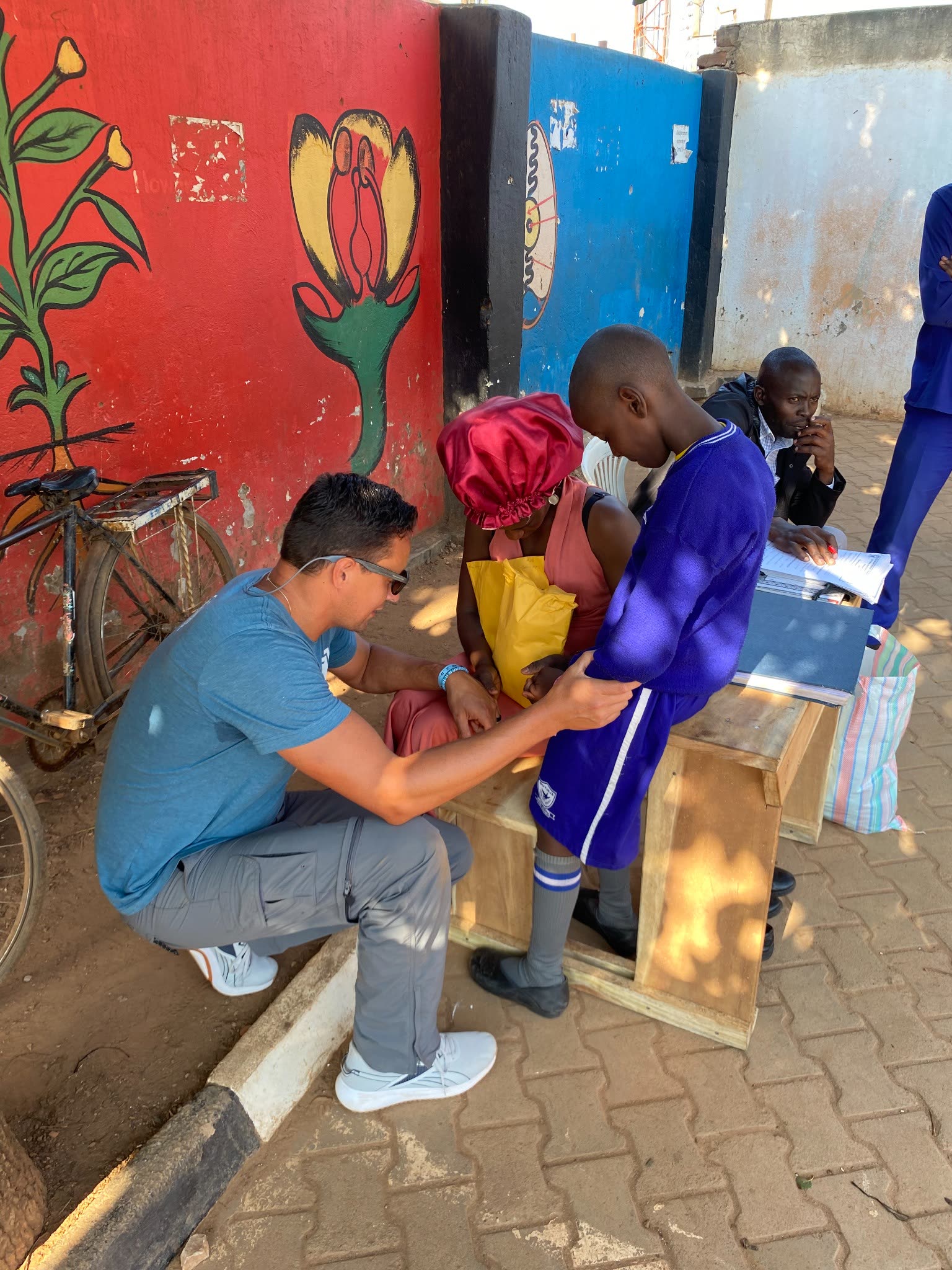 Chuckie encouraging a school child during the Uganda mission